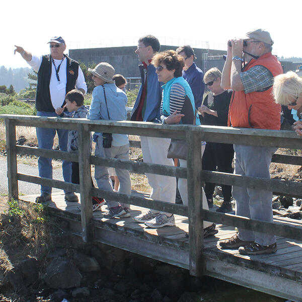 Volunteer at HMSC Visitor Center leads group around nearby marchlands